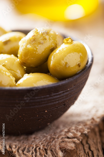 green marinated olives in bowl