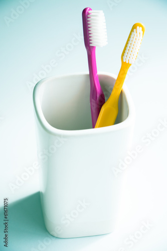 Toothbrushes in a mug