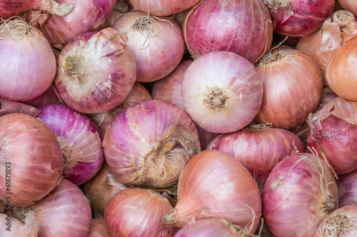 Pile of Red onions, in market