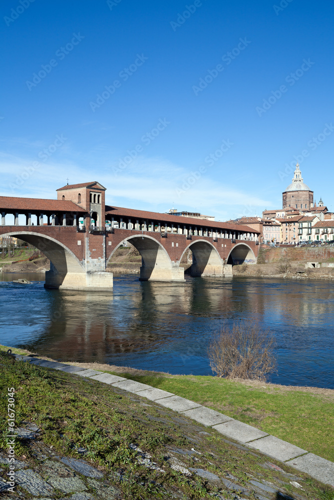 Naklejka premium Old bridge over Ticino river in Pavia, Italy