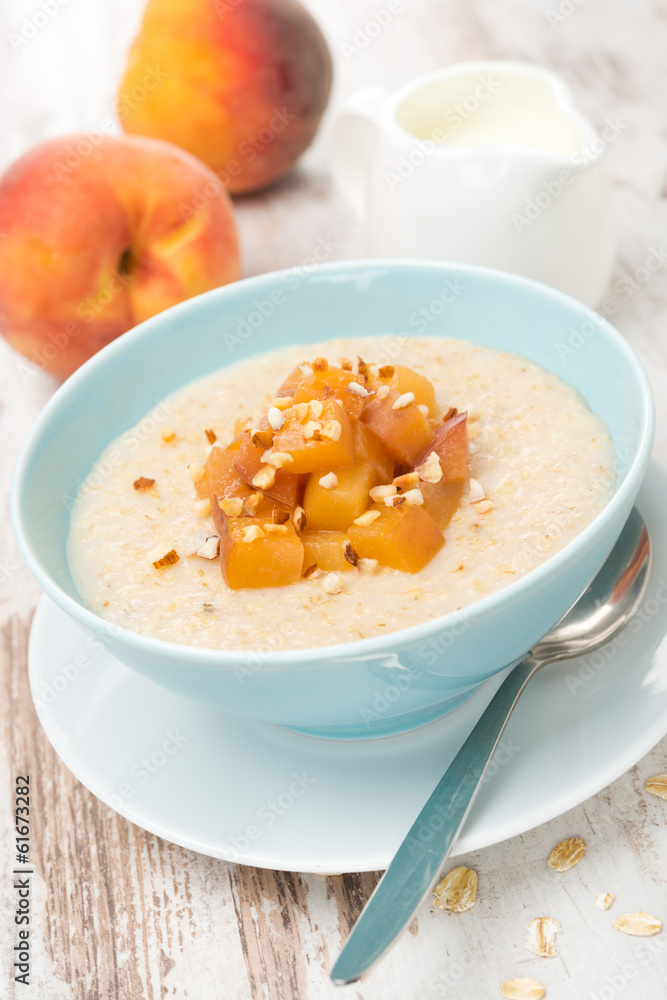 oatmeal with caramelized peaches in a bowl and jug of yogurt oatmeal with caramelized peaches in a bowl and jug of yogurt