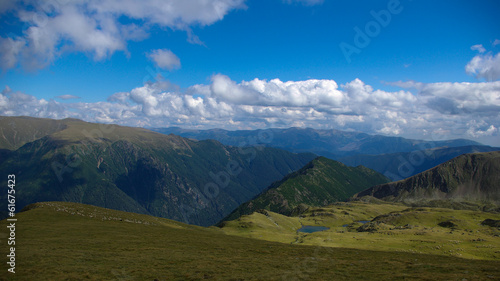 Mountain landscape with lake and clouds in the sky