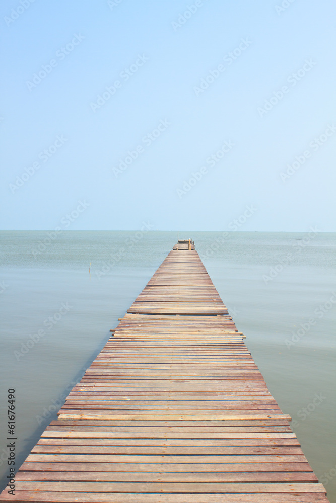 Wooden bridge into the sea