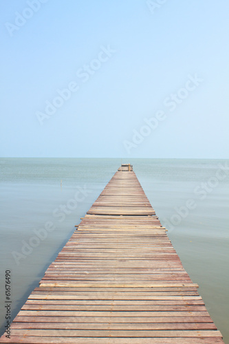 Wooden bridge into the sea
