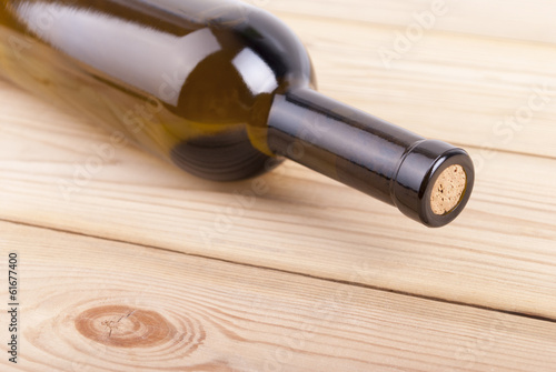 Bottle of wine on a wooden table.