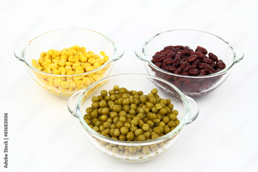 The peas, red bean, corn in glass dish on the white background The peas, red bean, corn in glass dish on the white background
