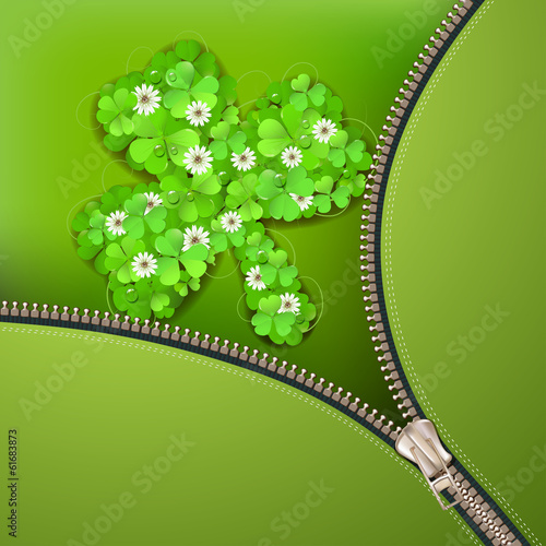 Opened metallic zipper over clover