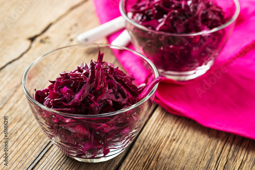 Red coleslaw on wooden background