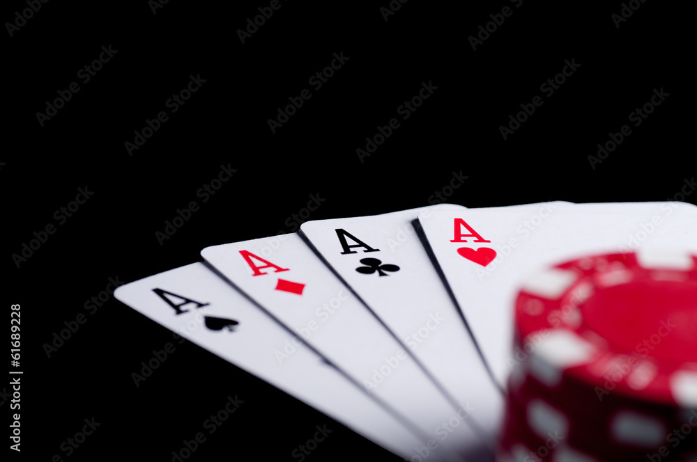 Obraz premium four aces high on black table with chips