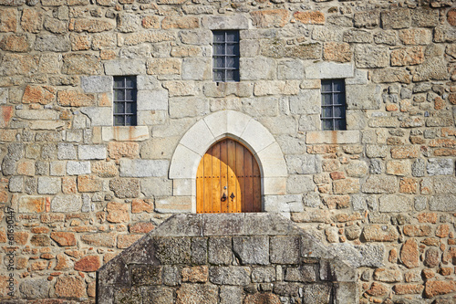 Ancient castle door at the Palace of the Dukes of Braganza, Guim © acnaleksy