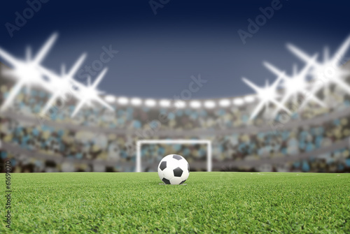 soccer ball on the football field in stadium at night © somkanokwan