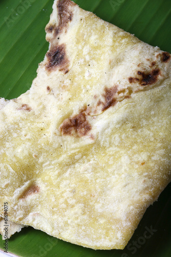 Obbattu – A sweet pancake made with wheat flour and jaggery photo