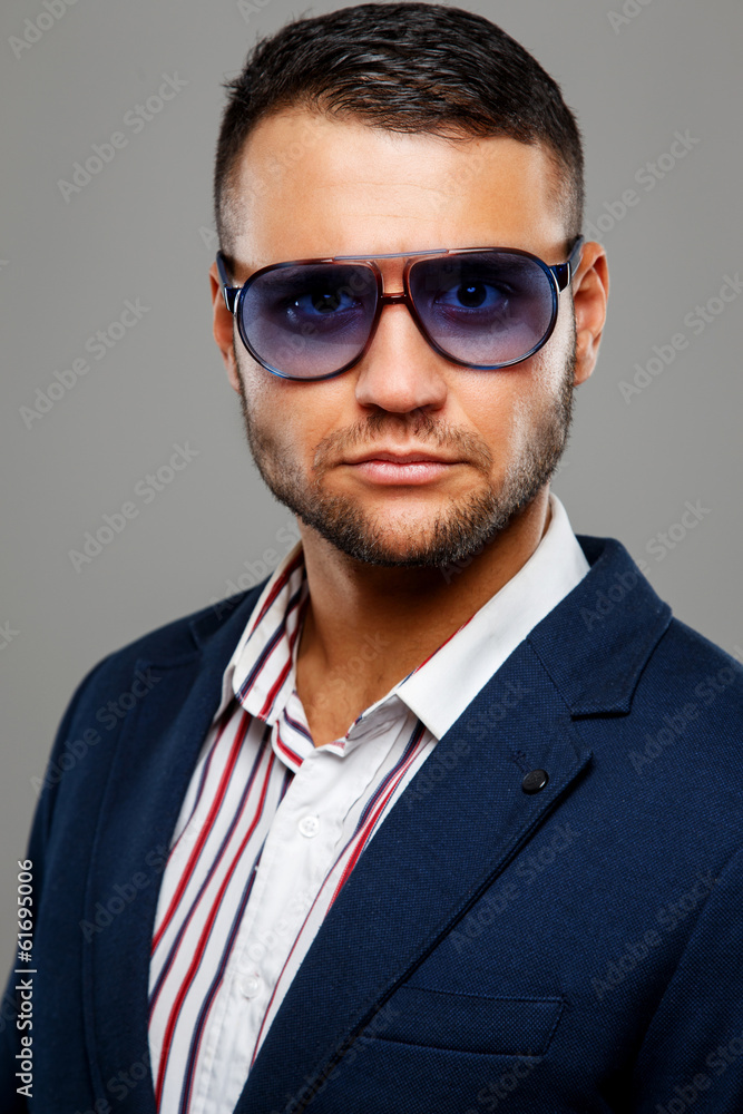 Man in a striped shirt in violet sunglasses Man in a striped shirt in violet sunglasses