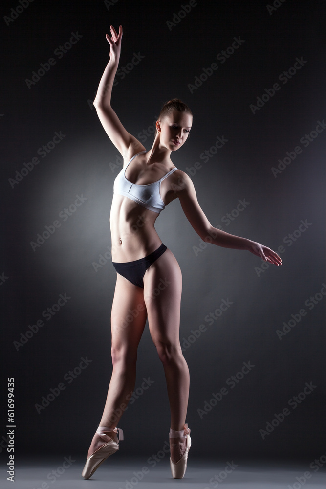 Shot of slim graceful ballerina posing in lingerie