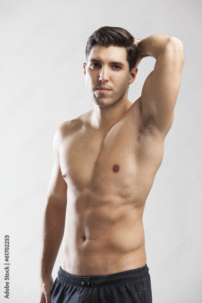 Fototapeta premium half naked man lifting weights