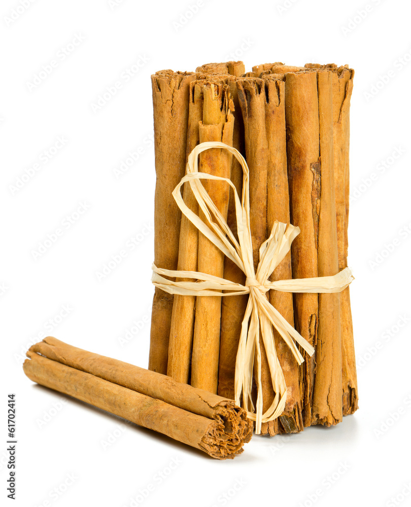 ceylon cinnamon sticks tied up on white background - obrazy, fototapety, plakaty 