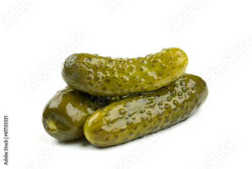 three marinated pickled cucumbers