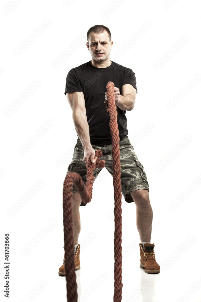 man doing rope training isolated on white - boot camp man doing rope training isolated on white - boot camp