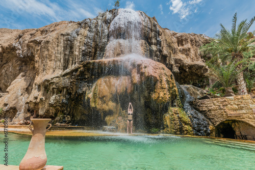 one woman bathing ma'in hot springs waterfall jordan