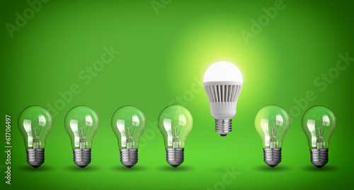 Row of light bulbs.Idea concept on green background.