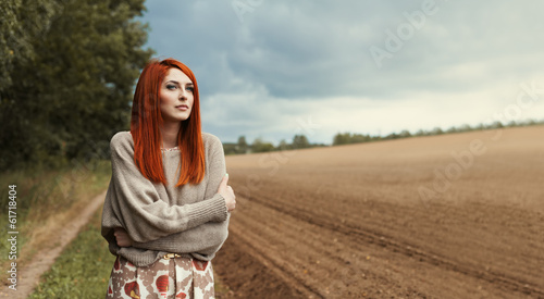 Beautiful sensual girl in a lonely field