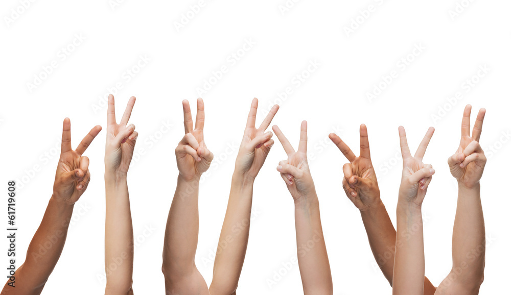 human hands showing v-sign human hands showing v-sign