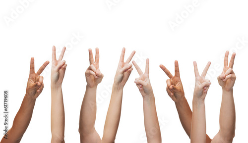 human hands showing v-sign