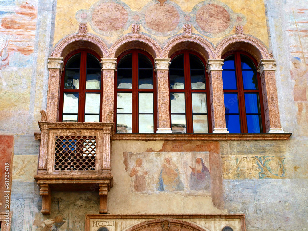 Obraz premium detail of the facade of the old building decorated in Trento in