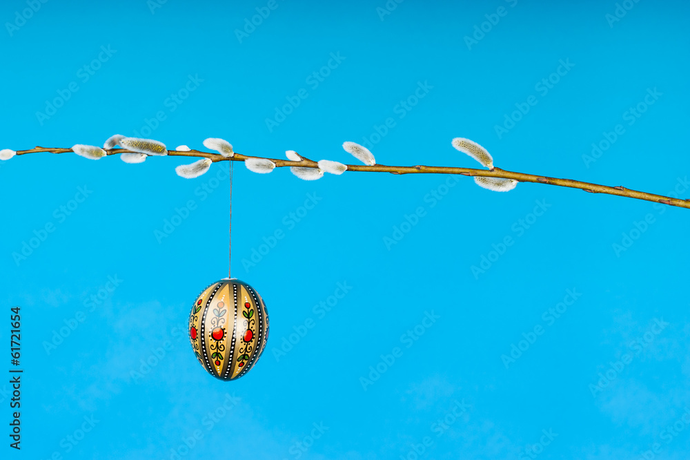 Fototapeta premium Easter eggs on catkin twig horizontal