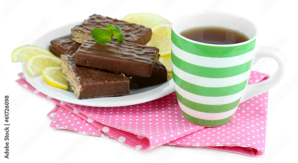 Cup of tea and sweets isolated on white Cup of tea and sweets isolated on white