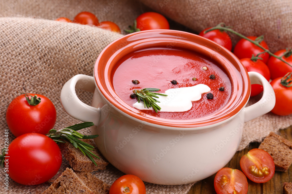 Tasty tomato soup on wooden table Tasty tomato soup on wooden table