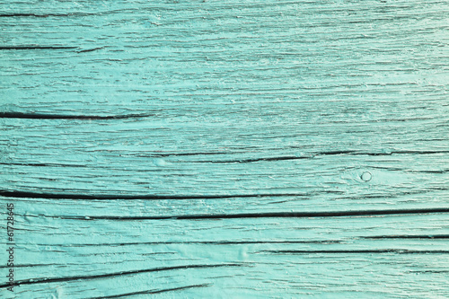 cracked wooden plank, green background