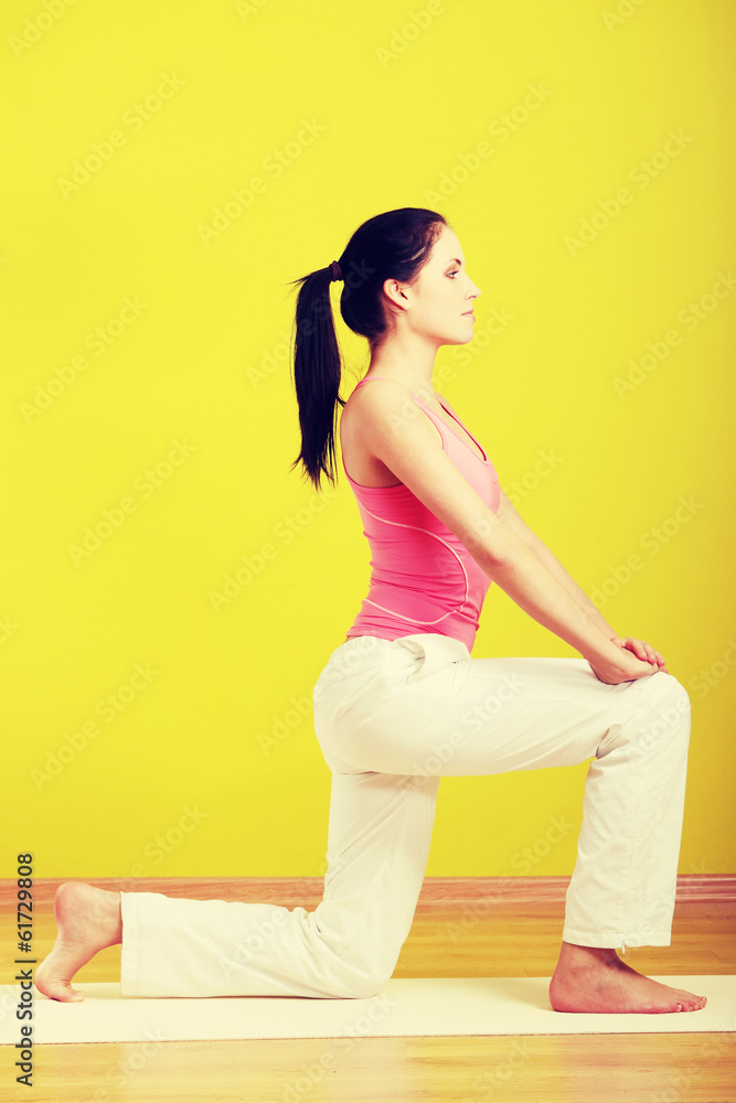 Fototapeta premium Woman exercising at home