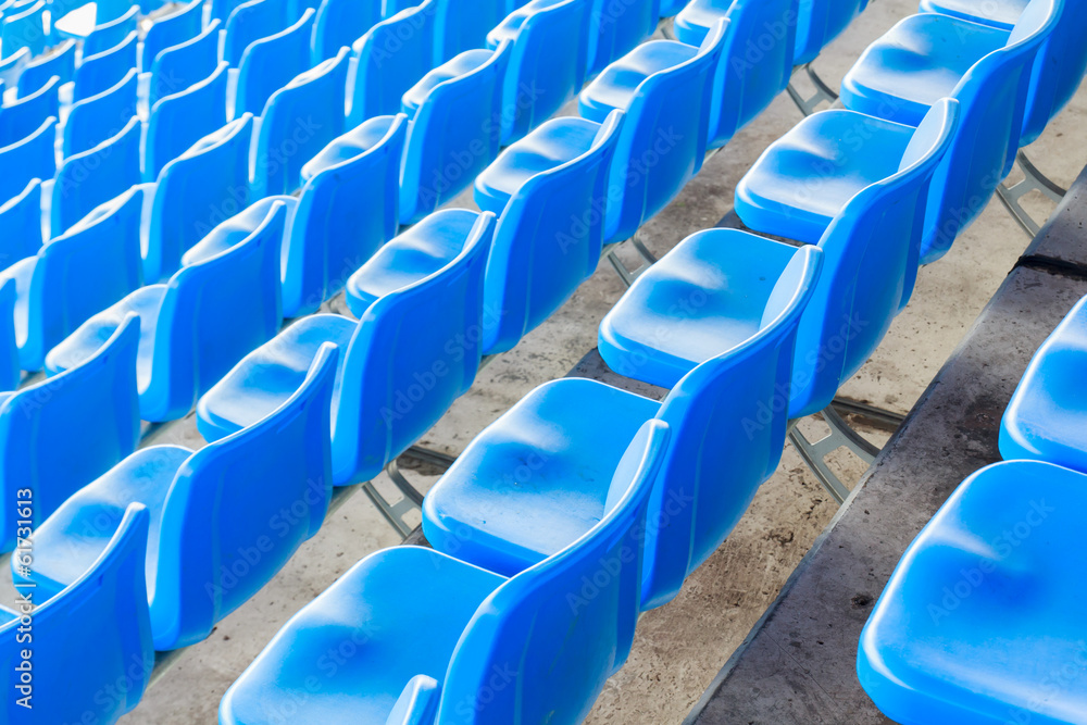 Fototapeta premium Empty dark blue chairs at the football Stadium