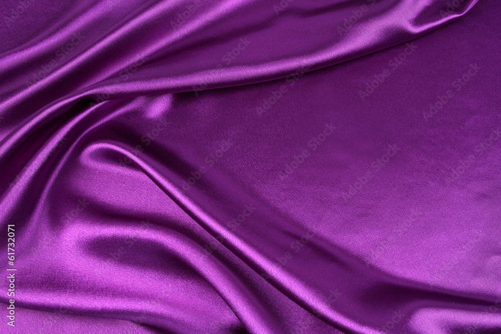 Obraz premium Purple silk fabric texture background. Copy space