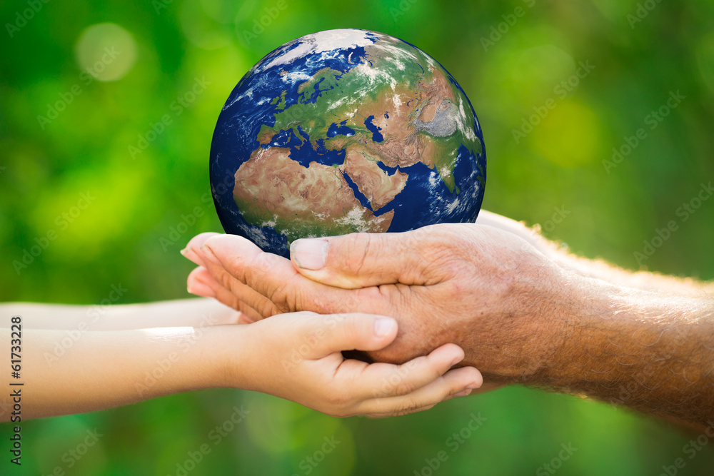 Child and man holding Earth in hands Child and man holding Earth in hands