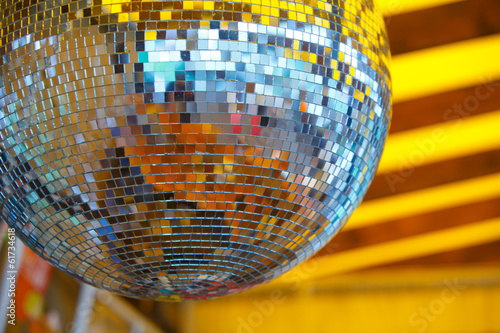 disco ball in yellow background