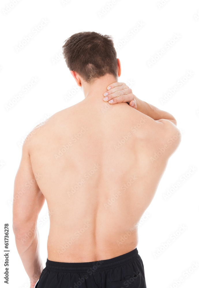 Young Man Suffering From Neck Pain