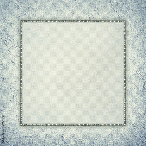 Blank sheet in picture frame on crumpled paper background