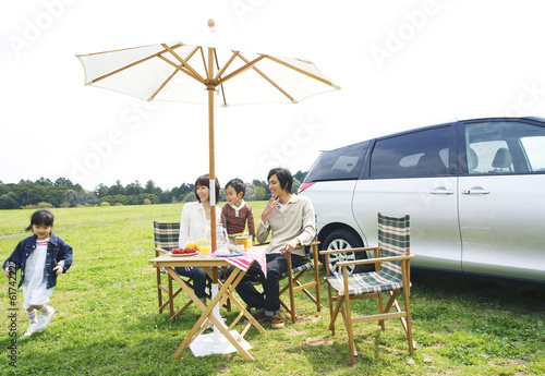 family enjoying picnic in prairie