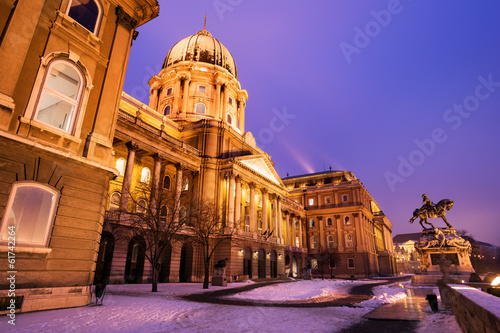 Snowy Buda Castle in Budapest under a purplish blue sky © mdorottya