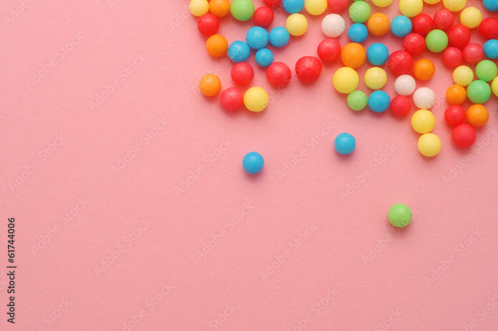 Cute little sweeets on pink background with copy space Cute little sweeets on pink background with copy space