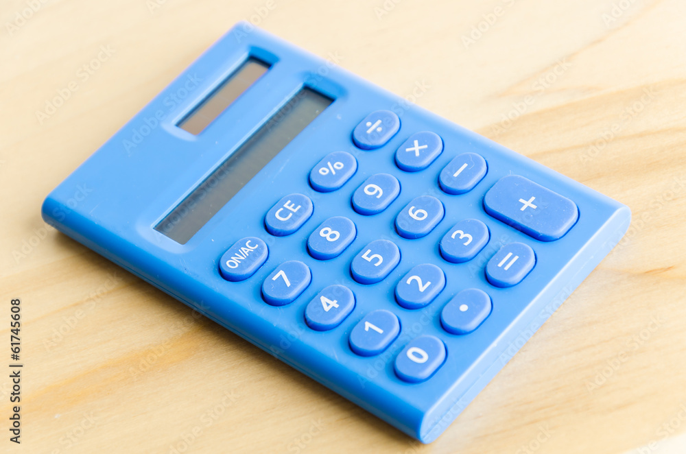 Calculator on wood table Calculator on wood table