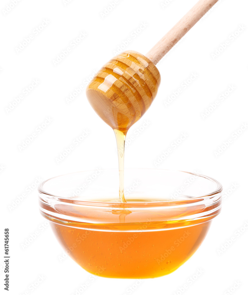 Bow of honey and wooden spoon. Bow of honey and wooden spoon.