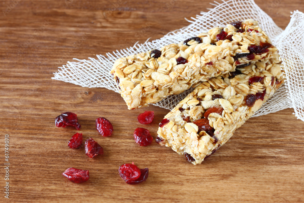 Fototapeta premium granola bar or energy bar on wooden background