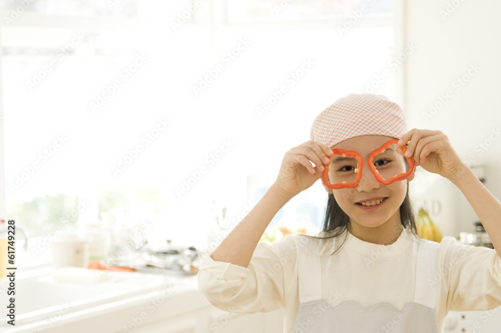 Japanese daughter preparing for cooking in kitchen Japanese daughter preparing for cooking in kitchen
