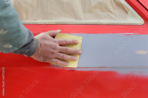 Принти на полотні Painting, car ready for repaint, worker sanding primer
