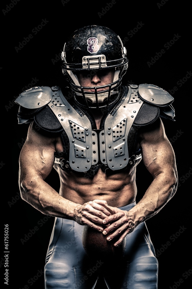 American football player wearing helmet and armour American football player wearing helmet and armour