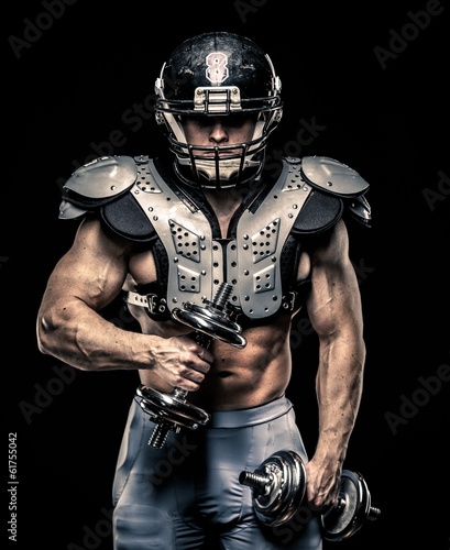 American football player wearing helmet and armour