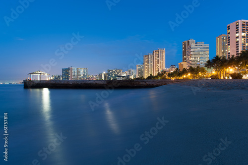Beach at Waikiki with buildings and a Gazebo